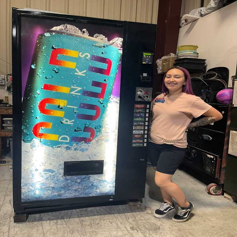 Michael Bennet with a Fletcher's Vending machine